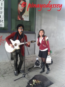 Posing with a street performer